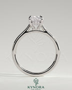Kynora CJ 2ct elongated cushion cut solitaire engagement ring with hidden halo, tapered band, and cathedral high setting.