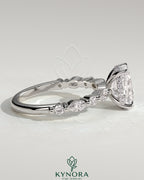 Kynora CJ 2ct elongated cushion solitaire engagement ring with marquise and round accent stones, hidden halo design.
