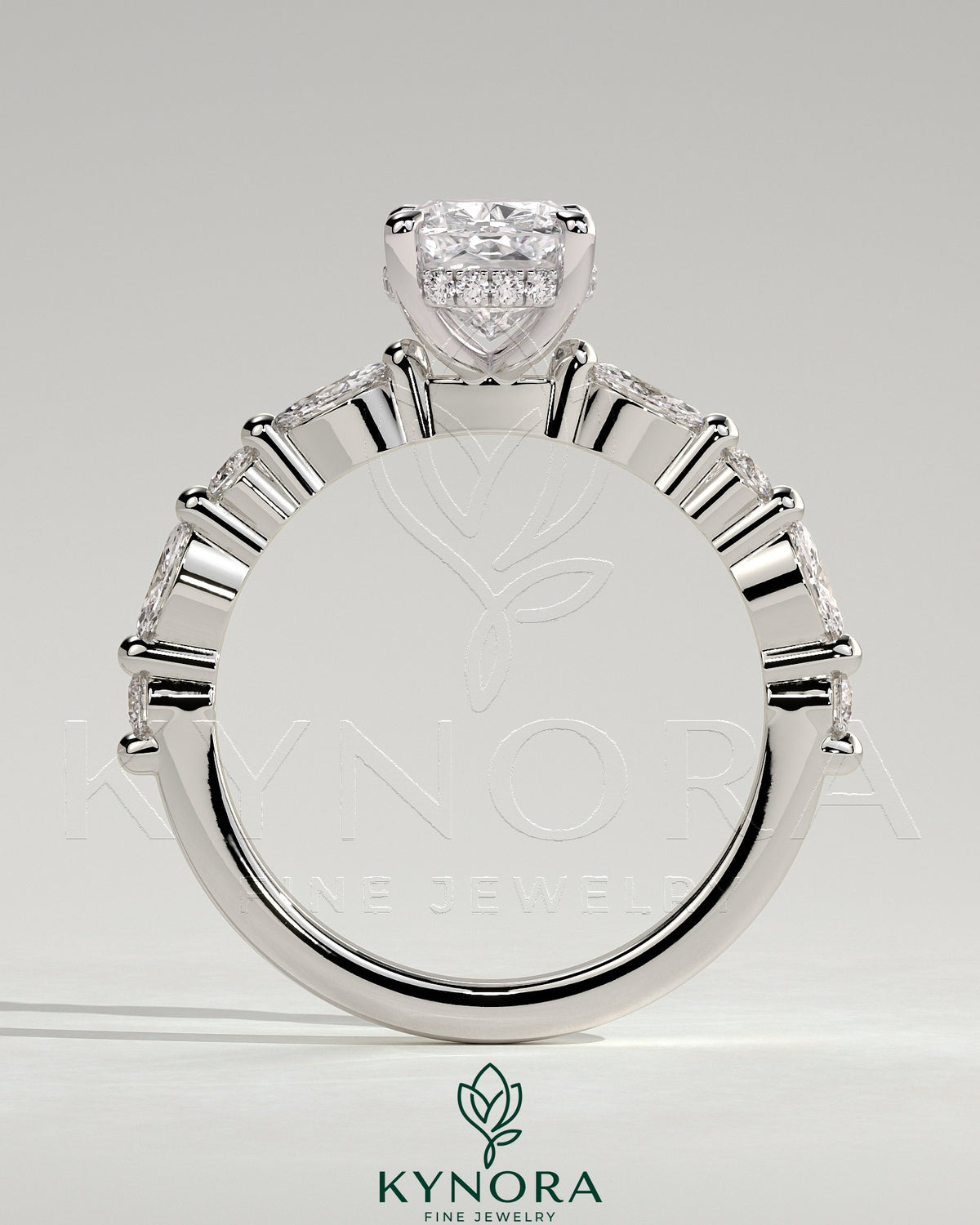 Kynora CJ 2ct elongated cushion solitaire engagement ring with marquise and round accent stones, hidden halo setting.