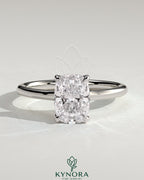 Kynora CJ 2ct elongated cushion claw solitaire engagement ring with petal gallery, leaf accents, and cathedral setting.