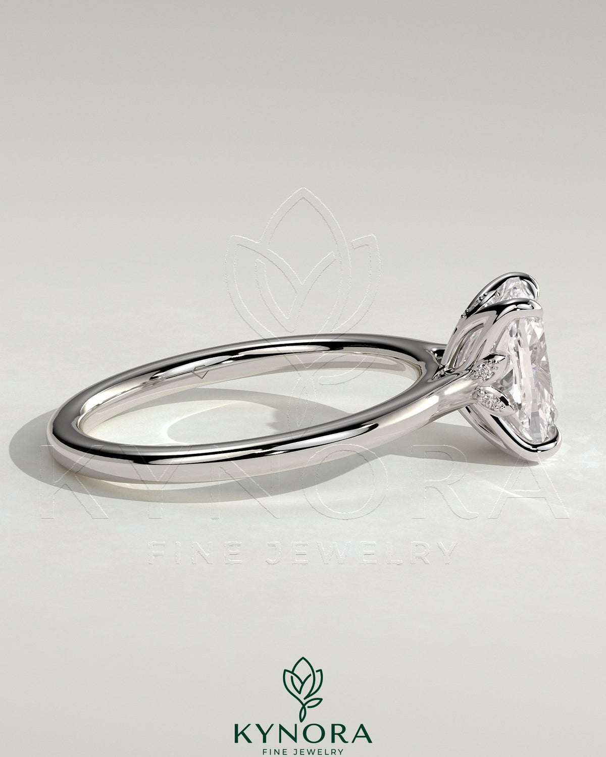 Kynora CJ 2ct elongated cushion solitaire engagement ring with petal gallery, leaf accents, and cathedral setting.