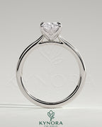 Kynora CJ 2ct elongated cushion solitaire engagement ring with petal gallery, leaf accents, and cathedral setting.
