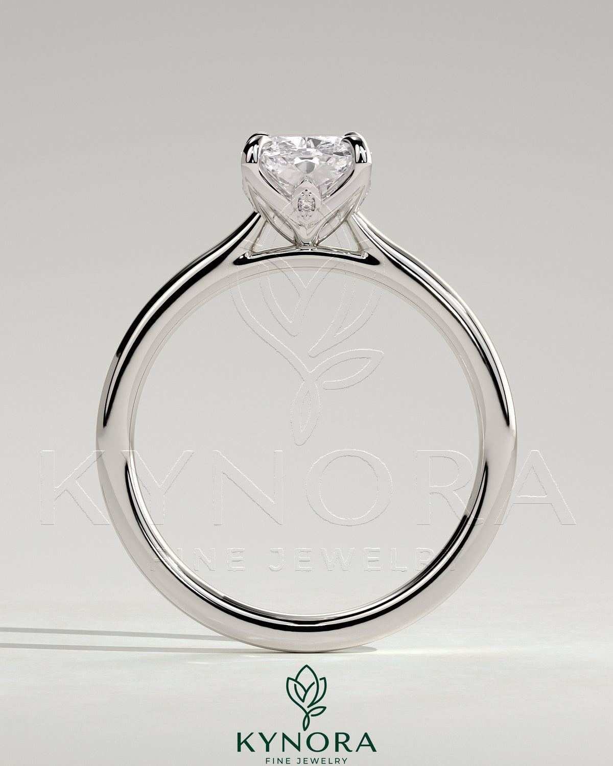 Kynora CJ 2ct elongated cushion solitaire engagement ring with petal gallery, leaf accents, and cathedral setting.