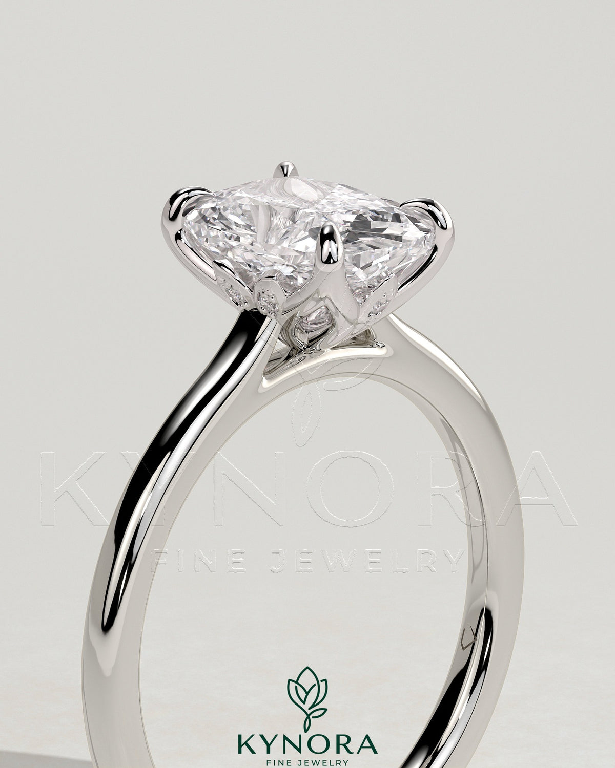 Kynora CJ 2ct elongated cushion cut diamond solitaire engagement ring with petal gallery, leaf accents, and cathedral setting.