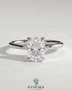 Kynora CJ 2ct elongated cushion claw solitaire engagement ring with petal gallery and leaf accents, crafted in elegant gold.