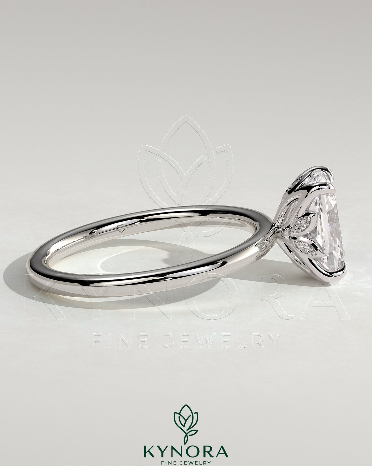 Kynora CJ 2ct elongated cushion claw solitaire engagement ring with petal gallery and leaf accents in gold.