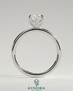 Kynora CJ 2ct elongated cushion claw solitaire engagement ring with petal gallery and accent leaf details, gold band.