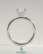 Kynora CJ 2ct elongated cushion claw solitaire engagement ring with petal gallery and accented tiara detail.
