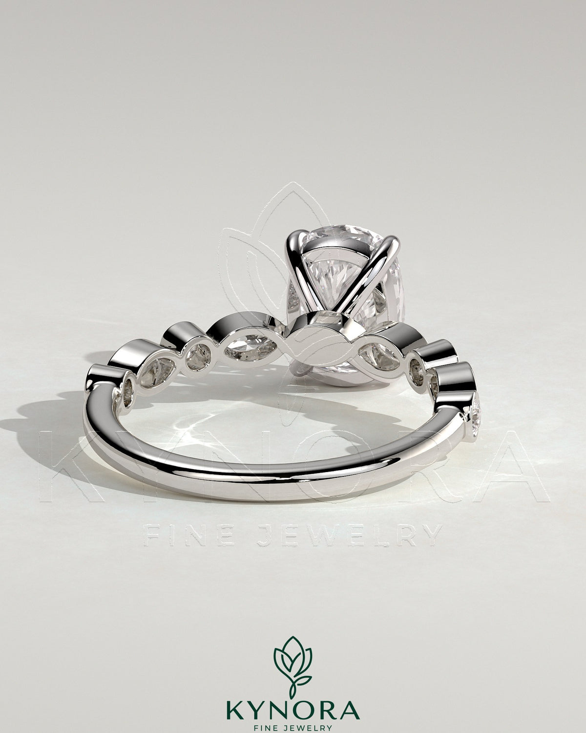 Kynora CJ 2ct elongated cushion solitaire engagement ring with round and marquise bezel accent stones, elegant and sparkling.