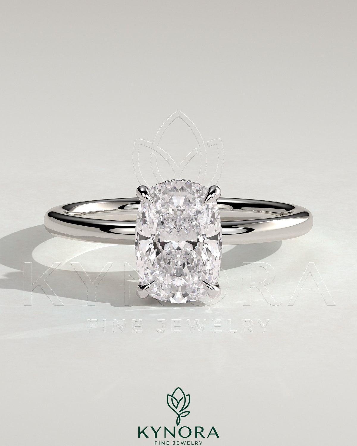 Kynora CJ 2ct elongated cushion solitaire engagement ring with wrap-around hidden halo, featuring a sparkling central stone.