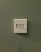 Kynora CJ 2ct elongated cushion solitaire engagement ring with wrap-around hidden halo and diamond band, showcasing elegant jewelry design.