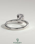 Kynora CJ 2ct elongated cushion double claw solitaire engagement ring with hidden halo, featuring sparkling diamond design.