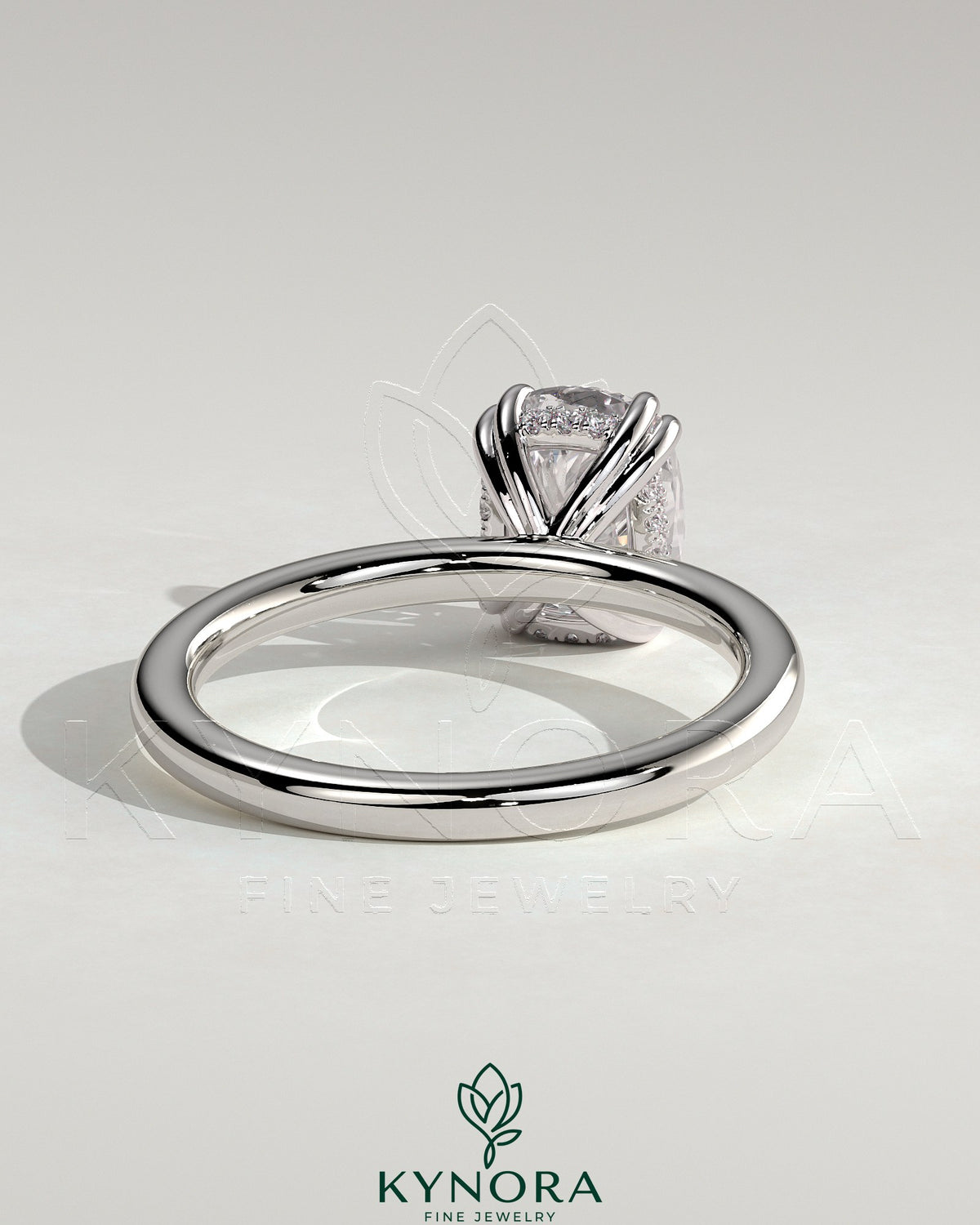 Kynora CJ 2ct elongated cushion double claw solitaire engagement ring with hidden halo, featuring sparkling diamond design.