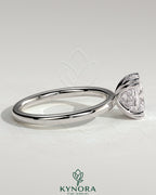 Kynora CJ 2ct elongated cushion solitaire engagement ring with double claw setting and hidden halo design.