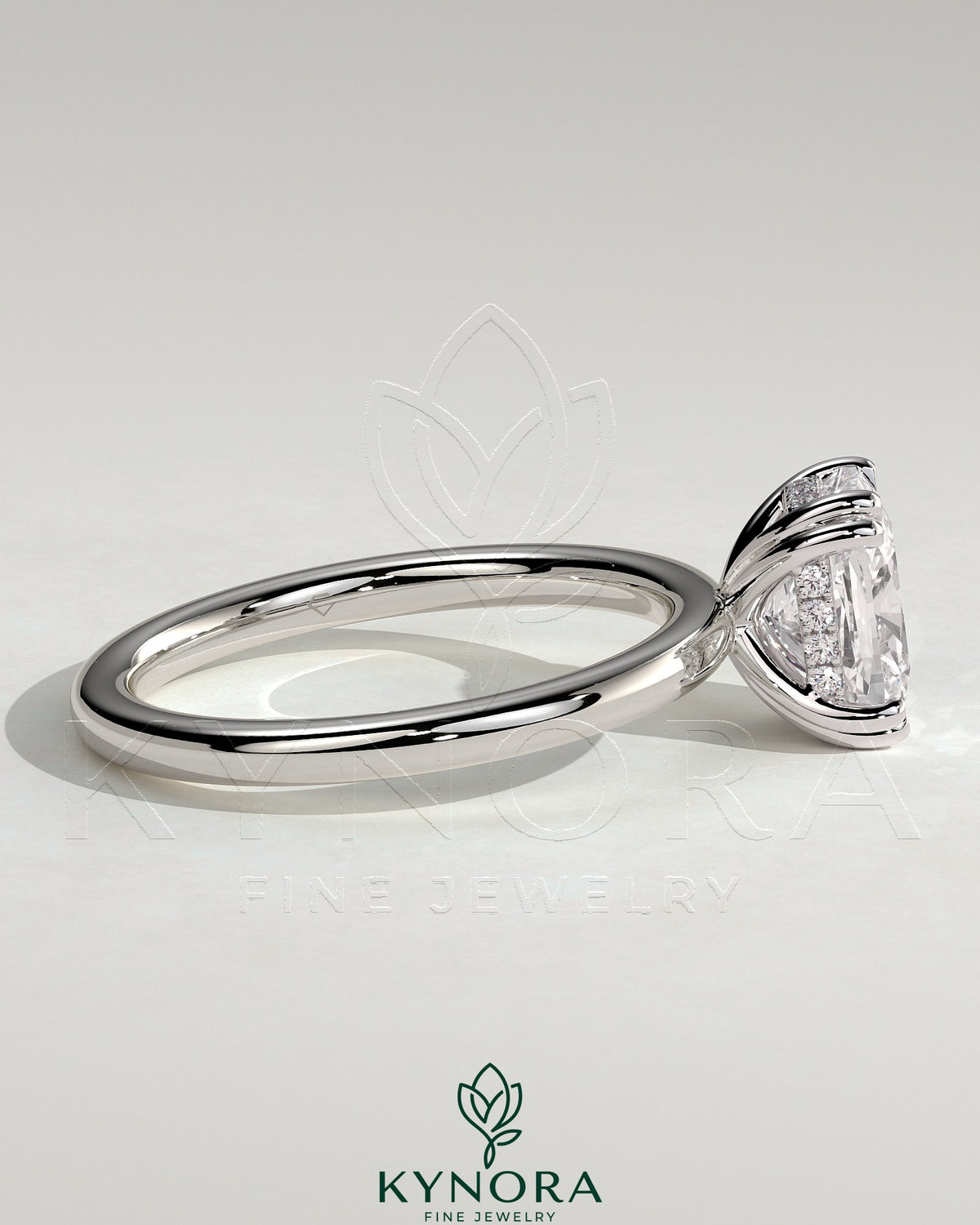 Kynora CJ 2ct elongated cushion solitaire engagement ring with double claw setting and hidden halo design.