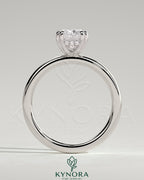 Kynora CJ 2ct elongated cushion double claw solitaire engagement ring with hidden halo, featuring a sparkling diamond setting.