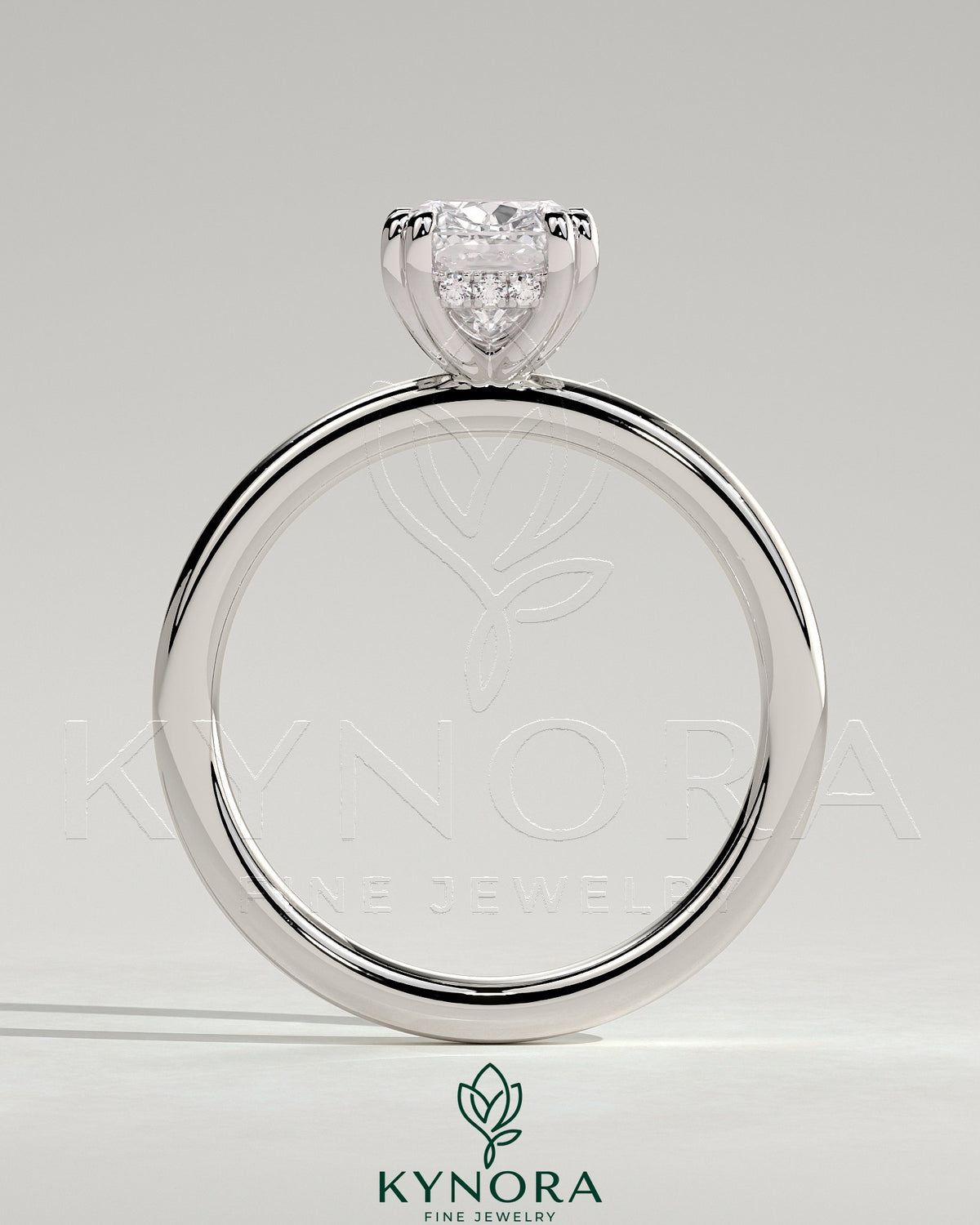 Kynora CJ 2ct elongated cushion double claw solitaire engagement ring with hidden halo, featuring a sparkling diamond setting.