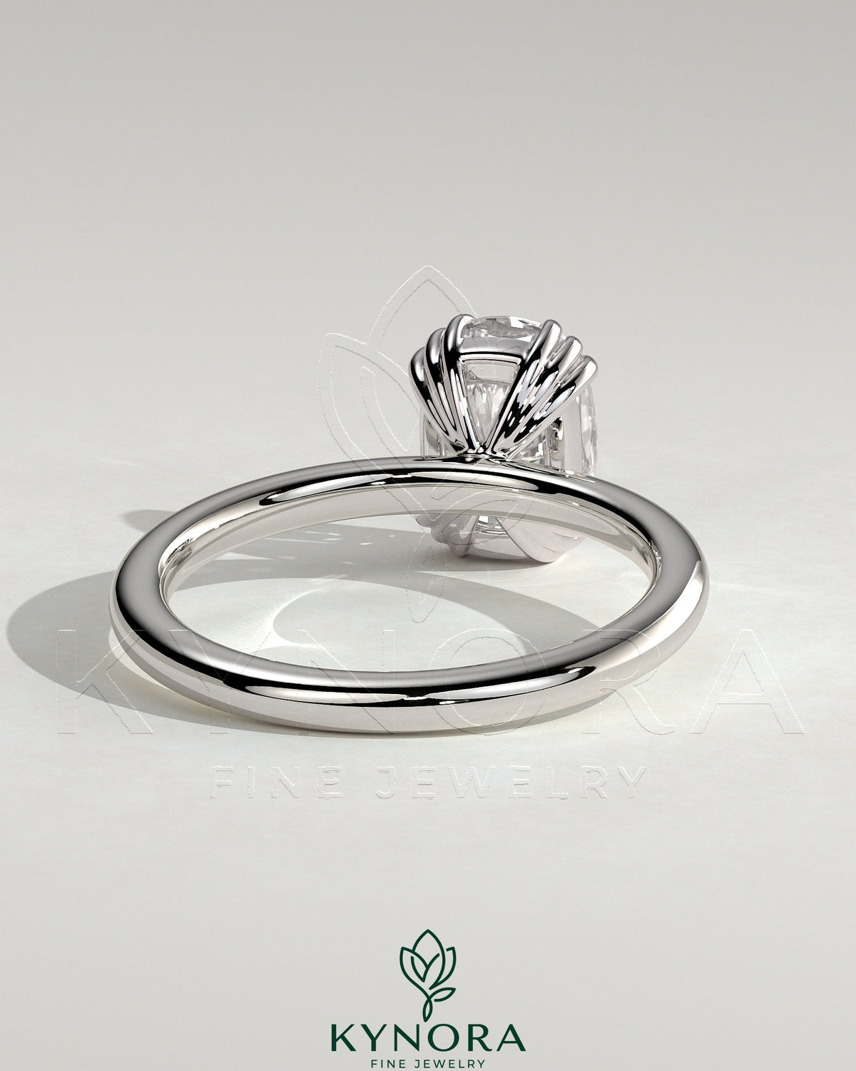 Kynora CJ 2ct elongated cushion triple claw solitaire engagement ring with a sparkling center diamond and sleek band.