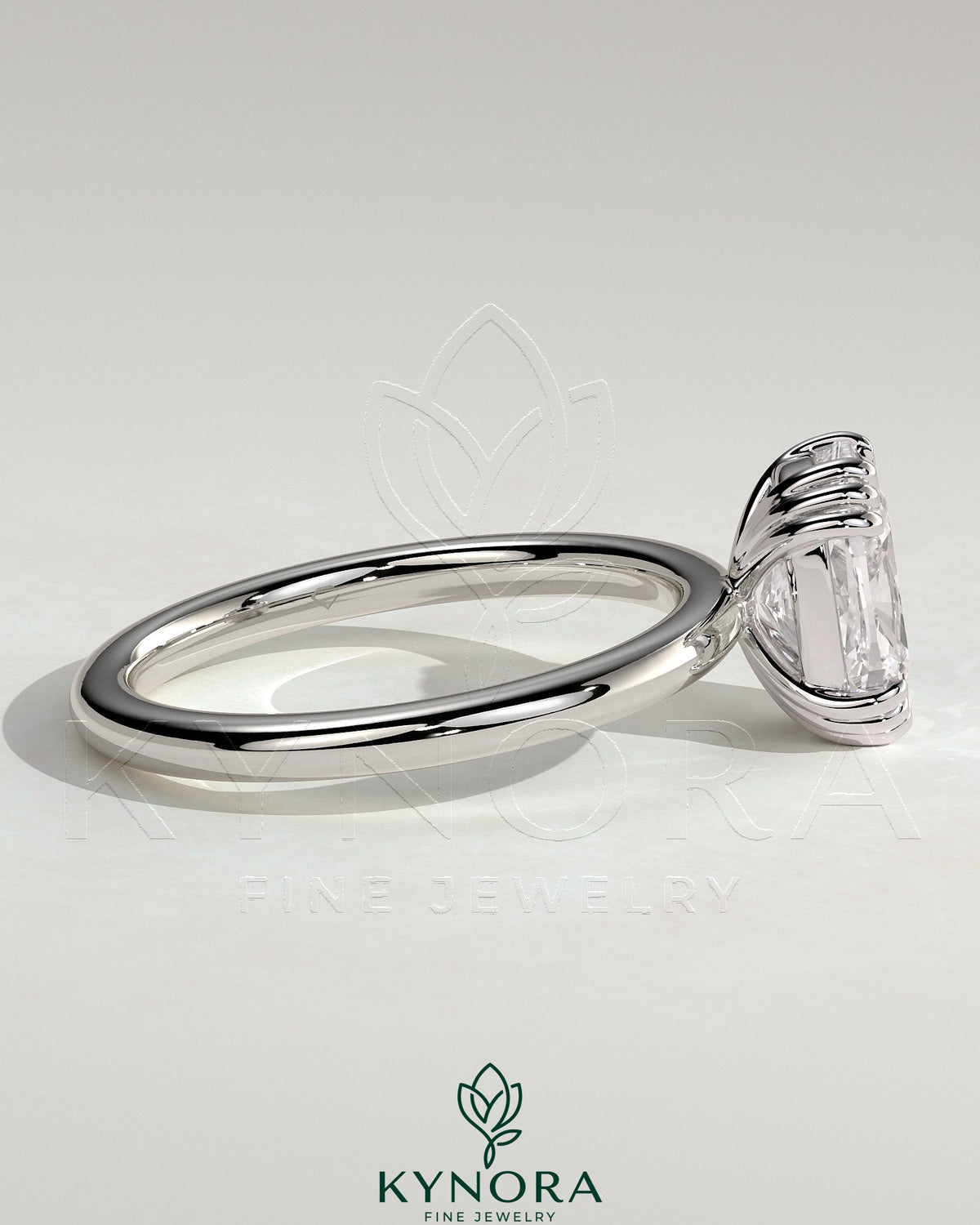 Kynora CJ 2ct elongated cushion cut diamond solitaire engagement ring with triple claw setting on a sleek band