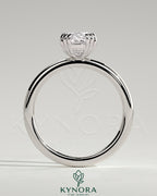 Kynora CJ 2ct elongated cushion triple claw solitaire engagement ring with a sparkling central diamond on a sleek band.