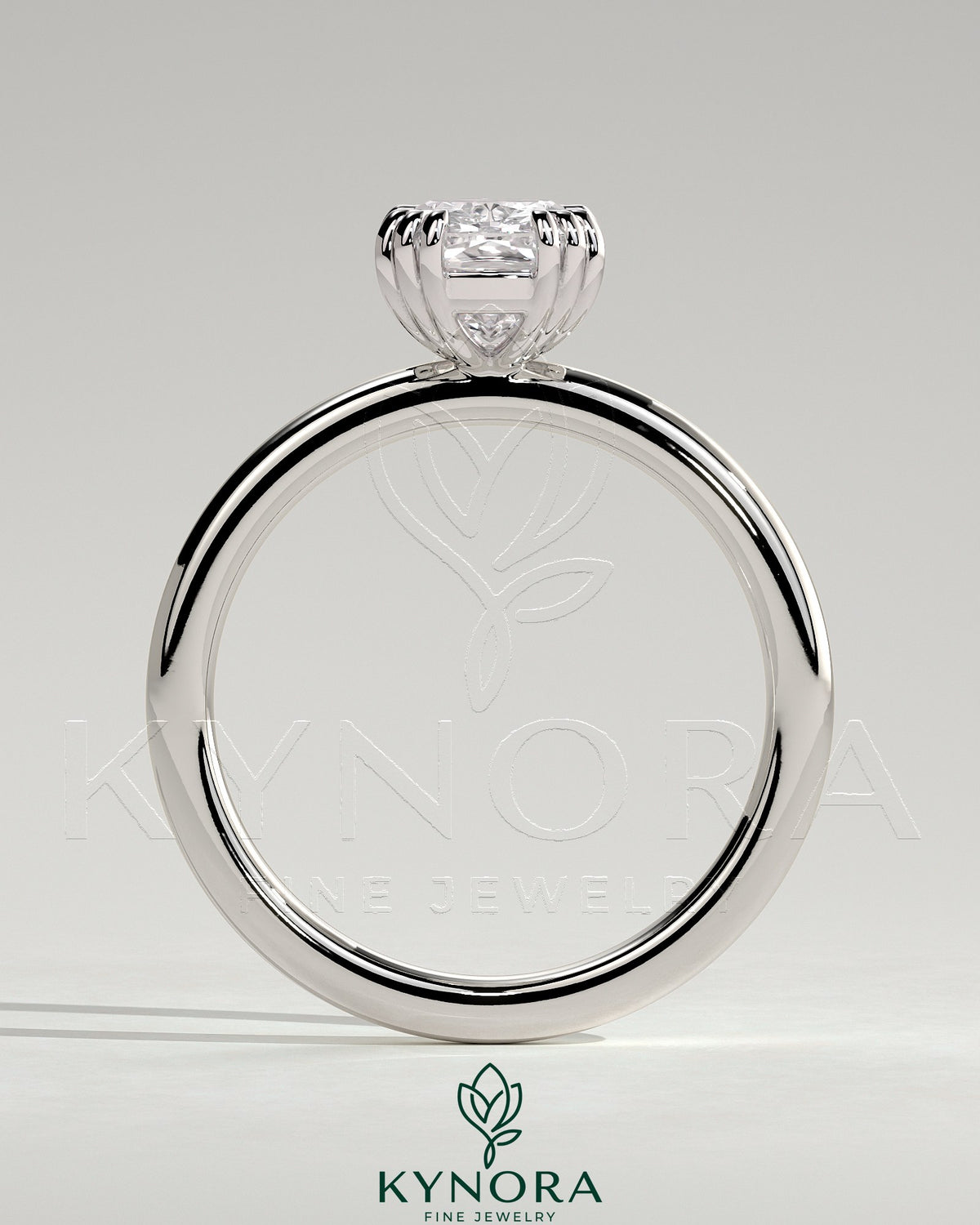 Kynora CJ 2ct elongated cushion triple claw solitaire engagement ring with a sparkling central diamond on a sleek band.