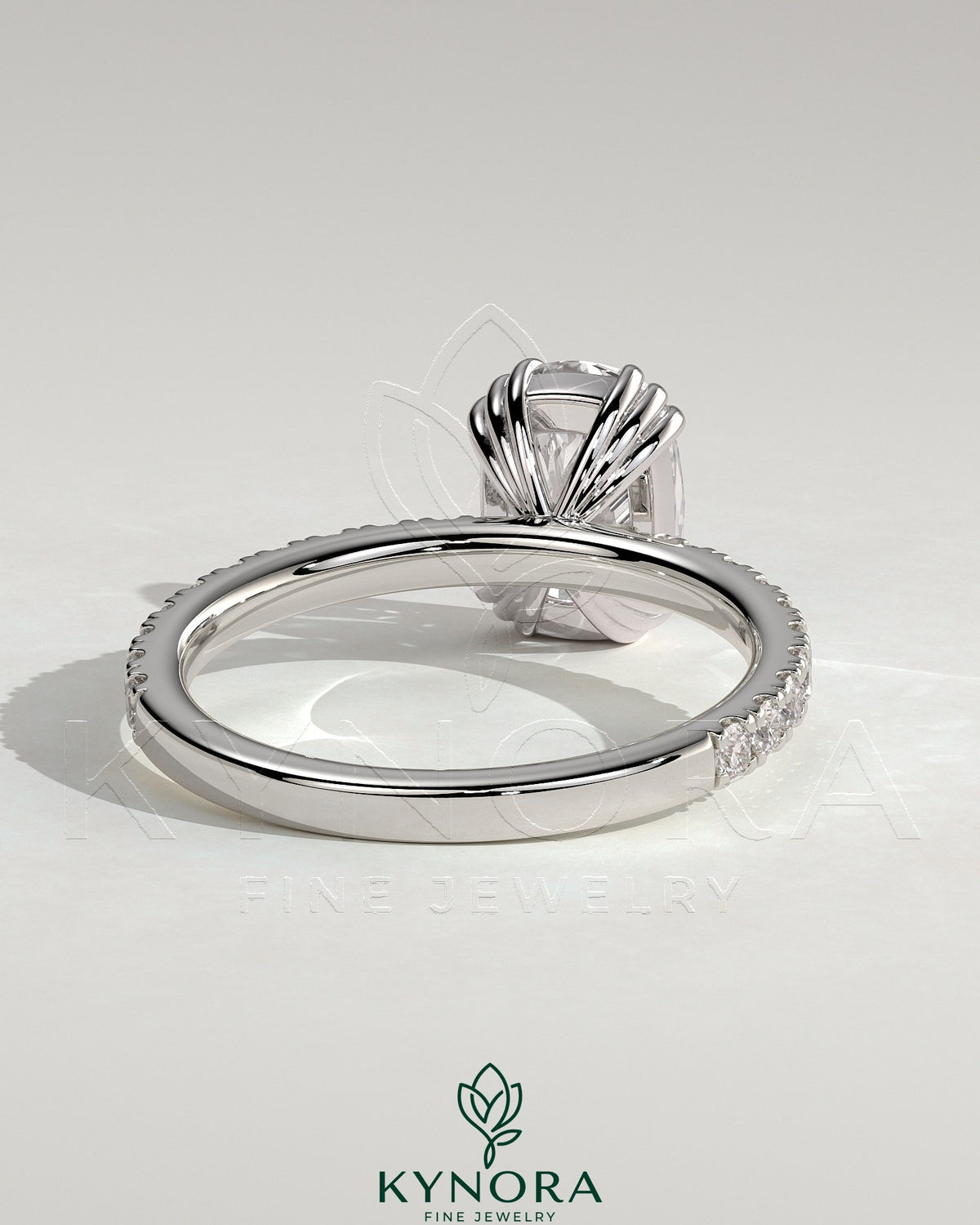 Kynora CJ 2ct elongated cushion solitaire engagement ring with triple claw setting and pavé band, crafted in elegant gold.