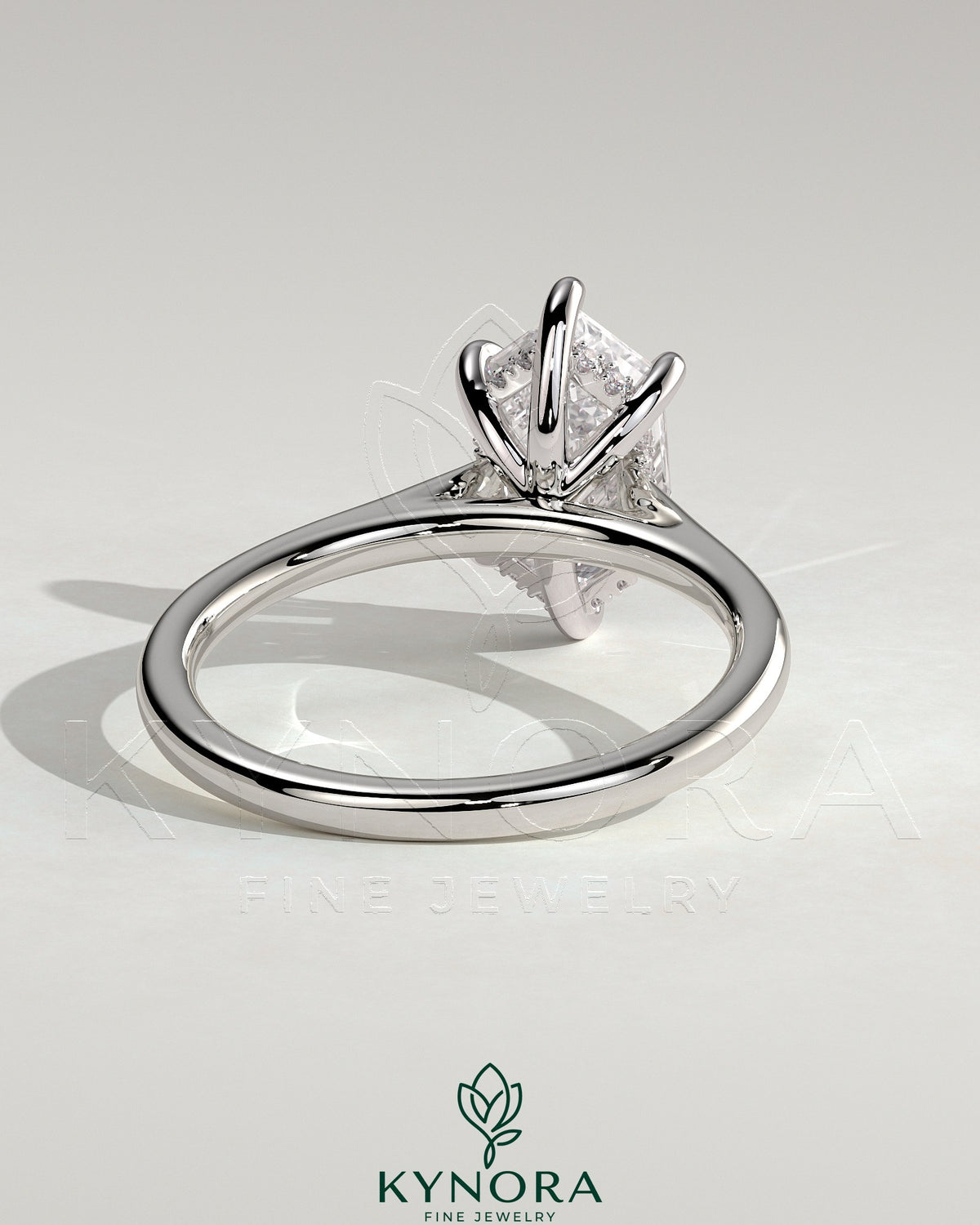 Kynora CJ 2ct elongated hexagon solitaire engagement ring with hidden halo and cathedral high setting, showcasing intricate design details.