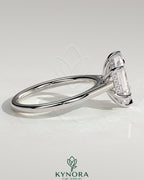 Kynora CJ 2ct elongated hexagon diamond solitaire engagement ring with hidden halo and cathedral high setting.