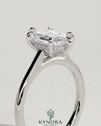 Kynora CJ 2ct elongated hexagon claw solitaire engagement ring with hidden halo and cathedral high setting, showcasing intricate design.