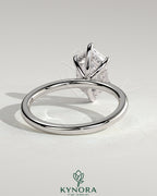 Kynora CJ 2ct elongated hexagon claw solitaire engagement ring with hidden halo showcasing the detailed design and sparkling diamond.