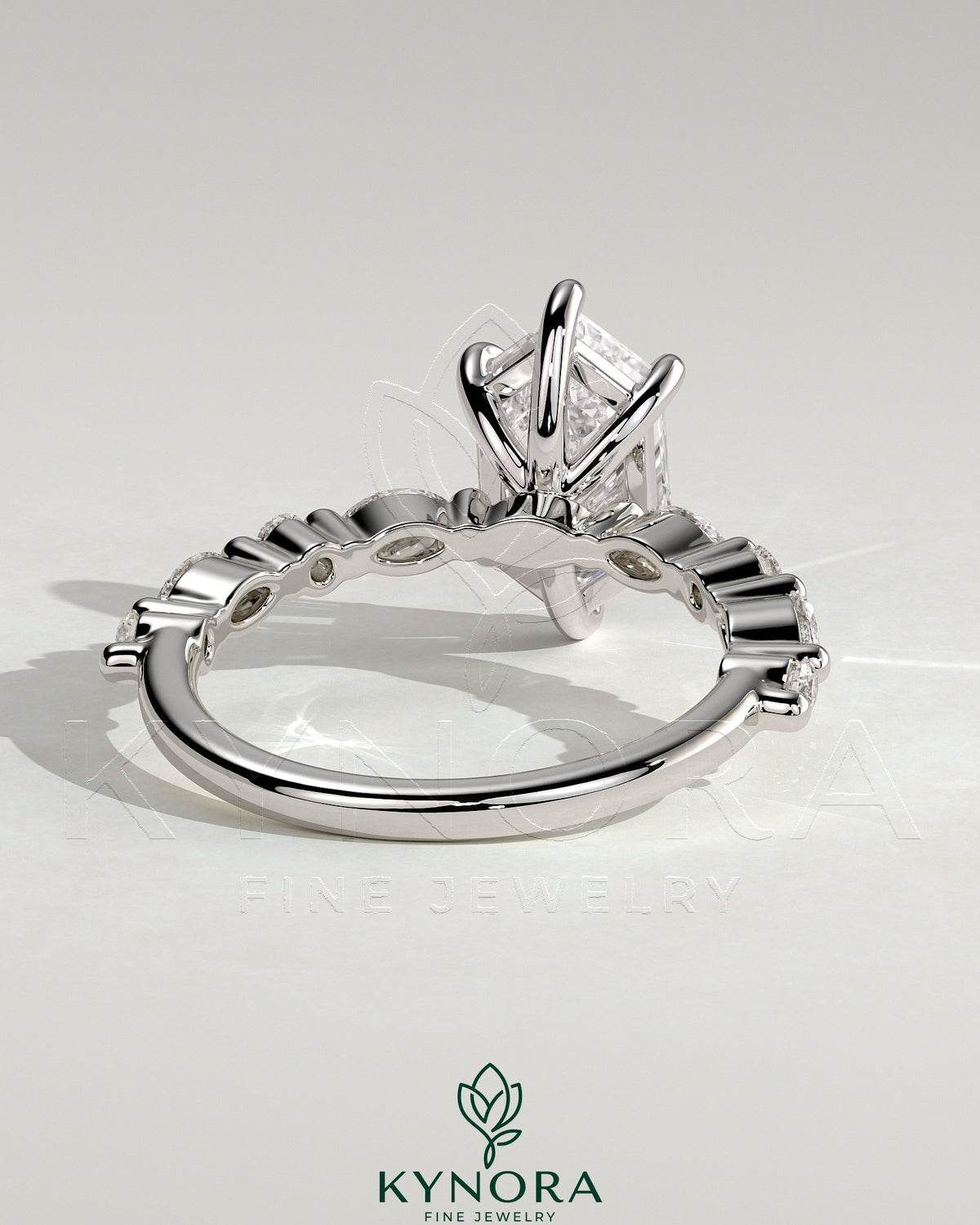 Kynora CJ 2ct elongated hexagon claw solitaire engagement ring with marquise and round accent stones, showcasing elegant diamond jewelry.
