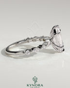 Kynora CJ 2ct elongated hexagon claw solitaire engagement ring with marquise and round accent stones, elegant jewelry design