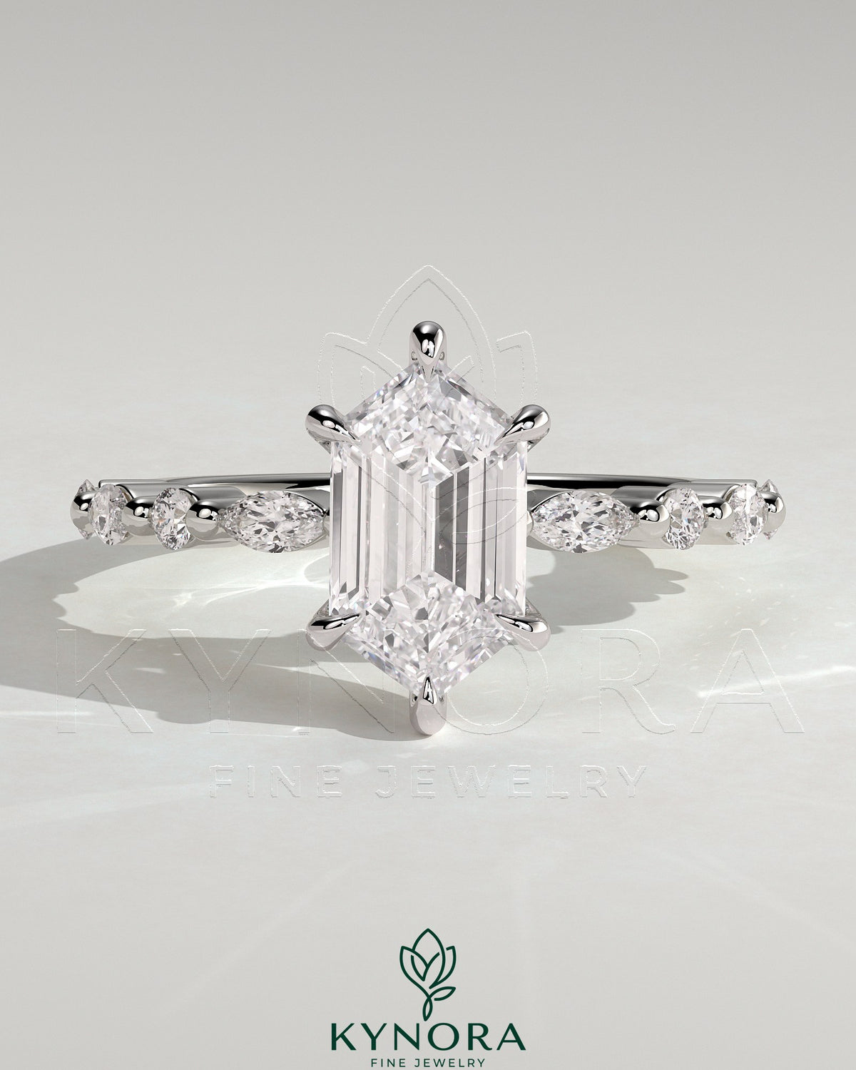 Kynora CJ 2ct elongated hexagon claw solitaire engagement ring with marquise and round accent stones, showcasing detailed craftsmanship. Main image