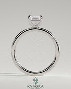 Kynora CJ 2ct emerald claw solitaire engagement ring with a central emerald-cut gemstone and elegant band.