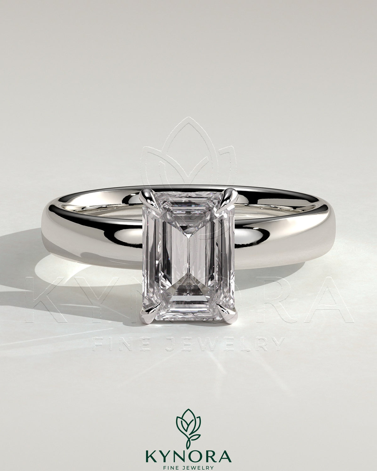 Kynora CJ 2ct emerald claw solitaire engagement ring with cigar band and hidden halo, showcasing a sparkling emerald centerpiece. Main image
