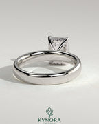 Kynora CJ 2ct emerald claw solitaire engagement ring with cigar band and hidden halo, showcasing detailed craftsmanship.