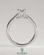 Kynora CJ 2ct emerald claw solitaire engagement ring with hidden halo and cathedral high setting, showcasing elegant jewelry design.