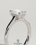 Kynora CJ 2ct emerald claw solitaire engagement ring with hidden halo and cathedral high setting, featuring intricate craftsmanship.