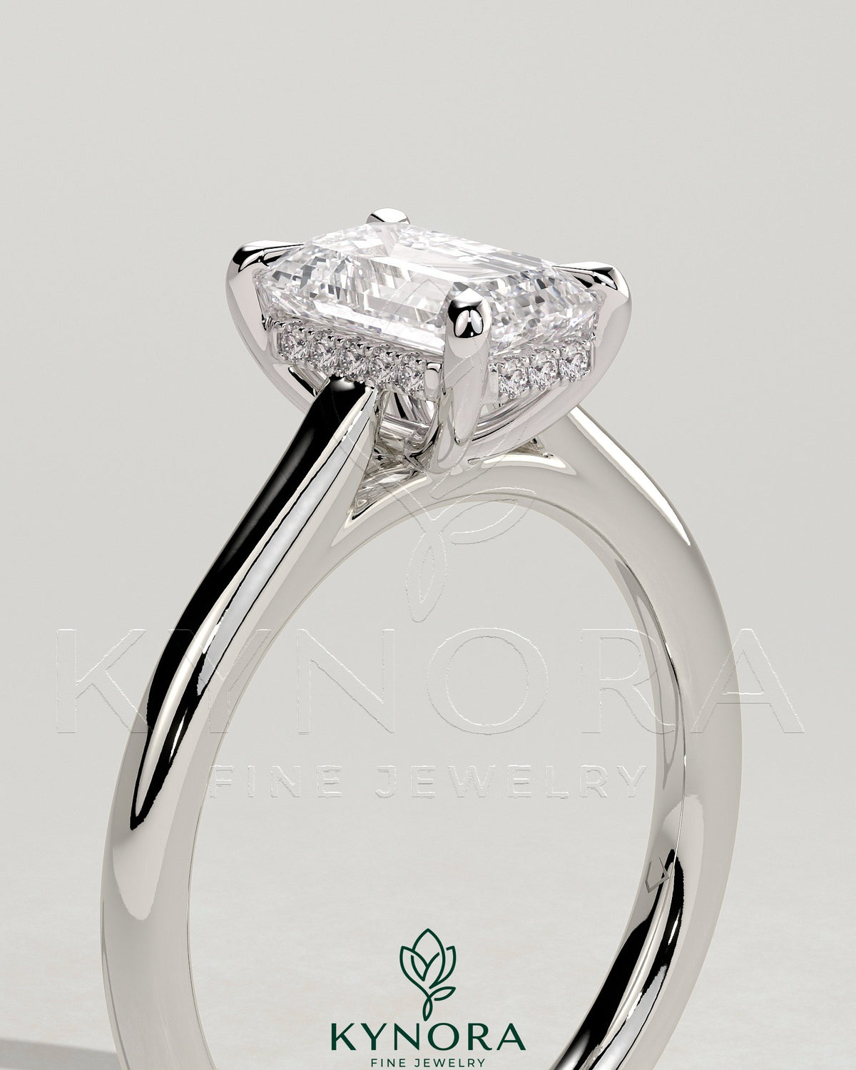 Kynora CJ 2ct emerald claw solitaire engagement ring with hidden halo and cathedral high setting, featuring intricate craftsmanship.