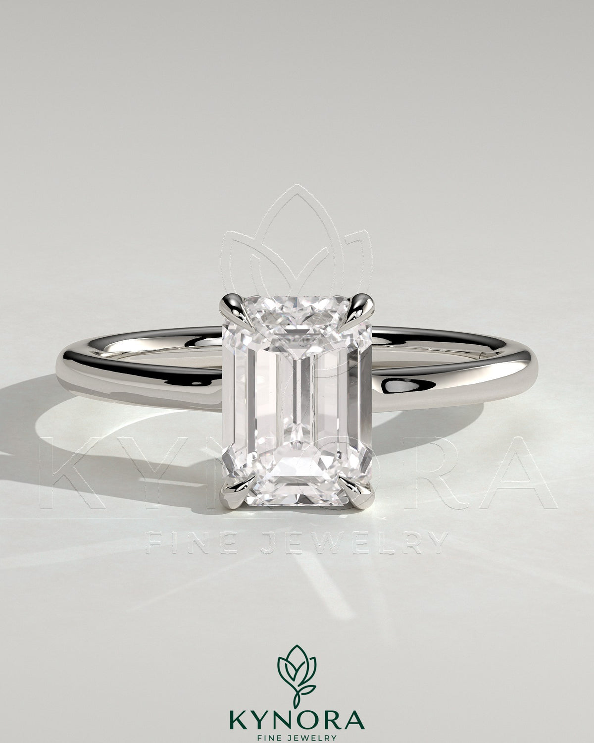 Kynora CJ 2ct emerald claw solitaire engagement ring with hidden halo and floating cathedral low setting, showcasing intricate design.