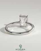 Kynora CJ 2ct emerald claw solitaire engagement ring with hidden halo and floating cathedral low setting, showcasing intricate design.