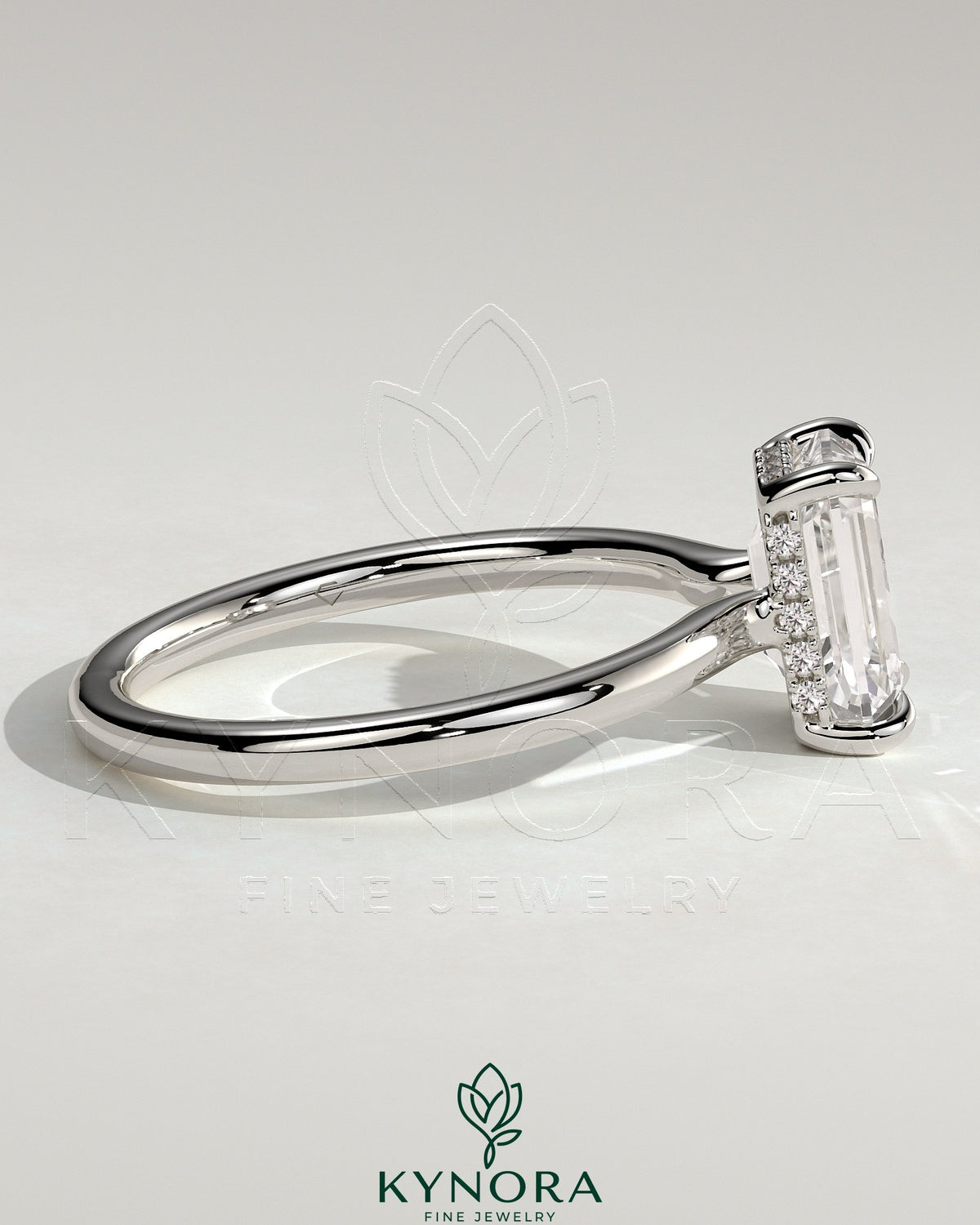 Kynora CJ 2ct emerald claw solitaire engagement ring with hidden halo and floating cathedral low setting, showcasing intricate design.