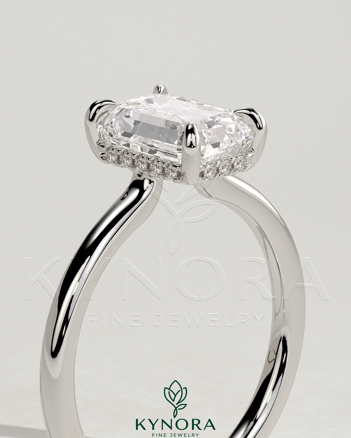 Kynora CJ 2ct emerald claw solitaire engagement ring with hidden halo and floating cathedral low setting, showcasing intricate design.