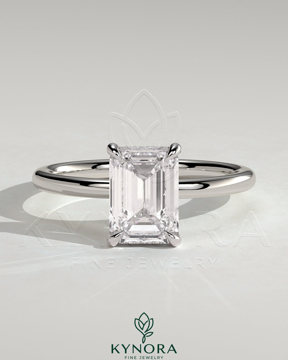 Kynora CJ 2ct emerald claw solitaire engagement ring with hidden halo, showcasing the sparkling central gemstone and intricate design. Main image