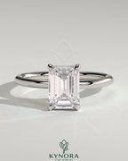 Kynora CJ 2ct emerald claw solitaire engagement ring with hidden halo, showcasing the sparkling central gemstone and intricate design.