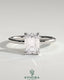 Kynora CJ 2ct emerald claw solitaire engagement ring with petal gallery, leaf accents, and cathedral setting.