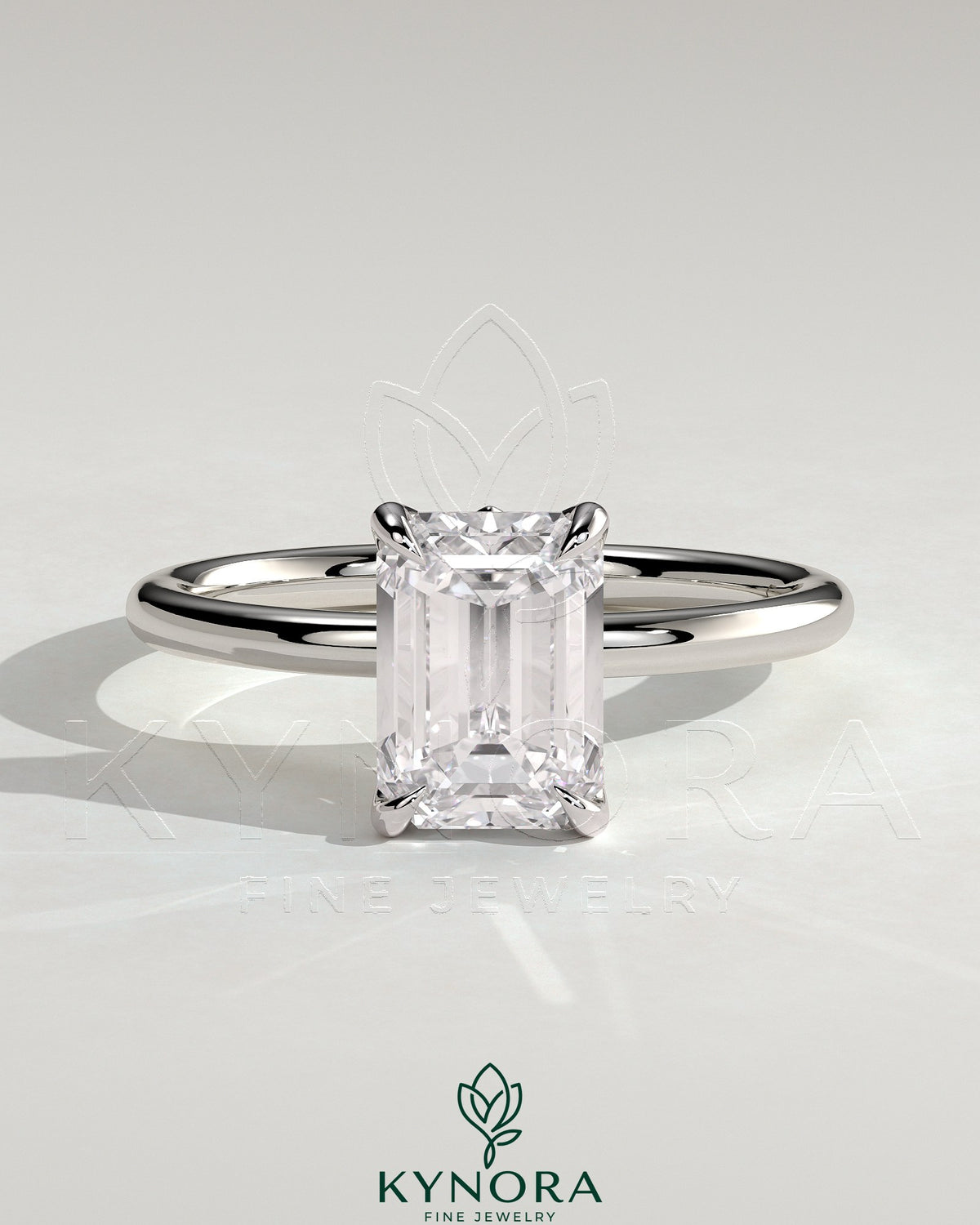 Kynora CJ 2ct emerald claw solitaire engagement ring with petal gallery and leaf accent detailing, crafted in elegant jewelry style. Main image