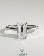 Kynora CJ 2ct emerald claw solitaire engagement ring with petal gallery and accented tiara detail, showcasing intricate design.