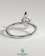 Kynora CJ 2ct marquise diamond solitaire engagement ring with four-prong setting, elegant and classic jewelry design.