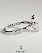 Kynora CJ 2ct marquise cut solitaire engagement ring with four prongs, showcasing elegant diamond setting and craftsmanship.
